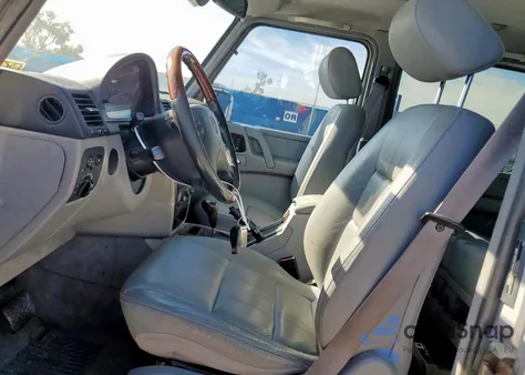 2002 Mercedes-Benz G 500 z USA, uszkodzony, nr VIN WDCYR49EX2X128555